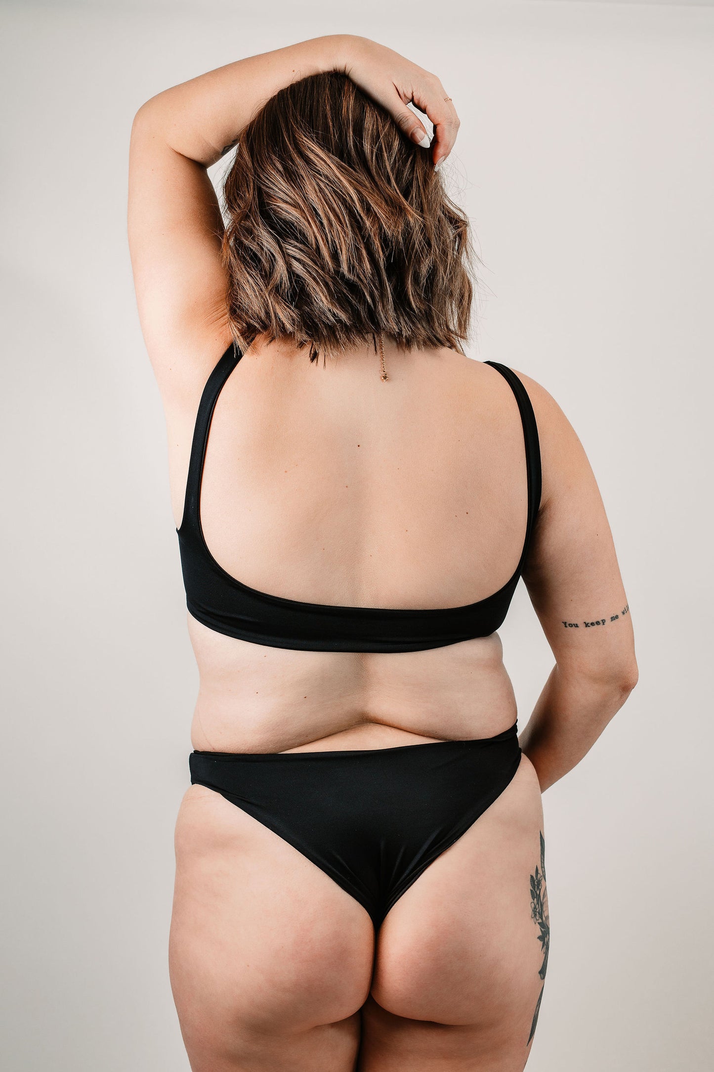 Natalie wears the Elise Bottoms in size Large. Back view.