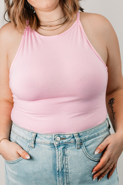 Natalie wears the Baby Pink Willa Bodysuit in size L. Close up.