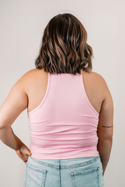 Natalie wears the Willa High Neck Tank in Baby Pink in size L. Back view.