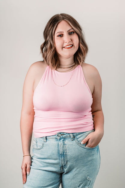 Natalie wears the Willa High Neck Tank in Baby Pink in size L. Front view.